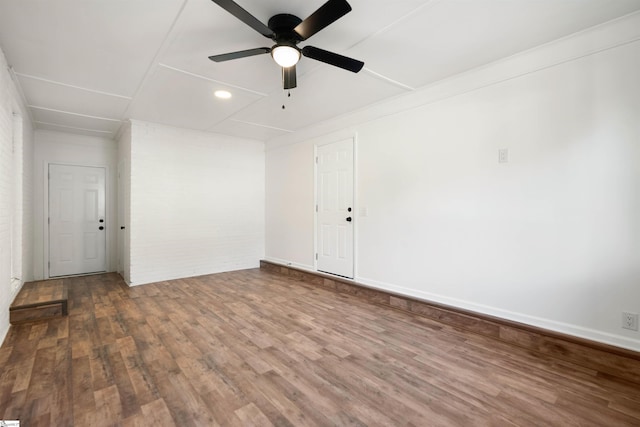 empty room featuring hardwood / wood-style flooring and ceiling fan