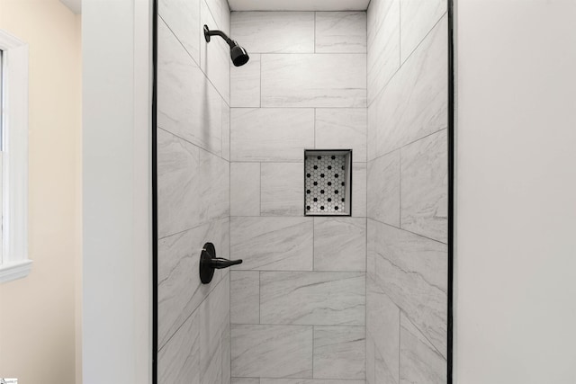 details featuring a tile shower