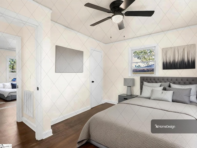 bedroom with ceiling fan and dark hardwood / wood-style flooring