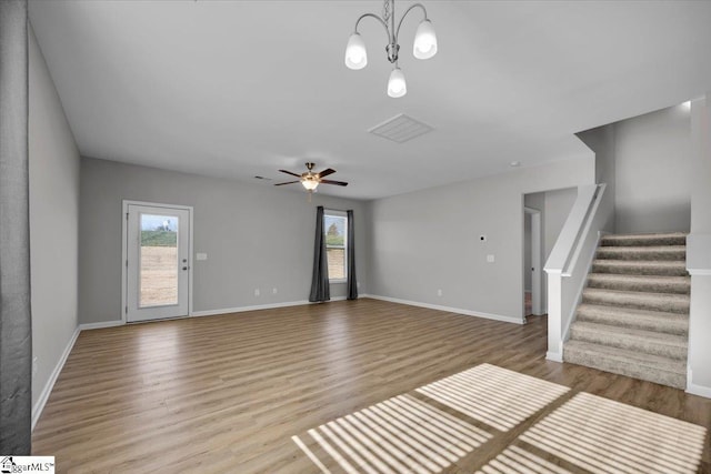 unfurnished living room with plenty of natural light, light hardwood / wood-style floors, and ceiling fan