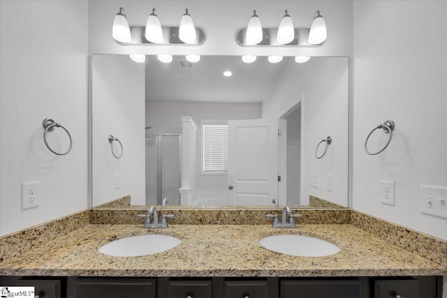 bathroom with vanity and walk in shower