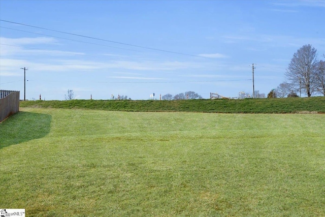 view of yard with a rural view