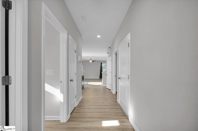 hall with light hardwood / wood-style floors