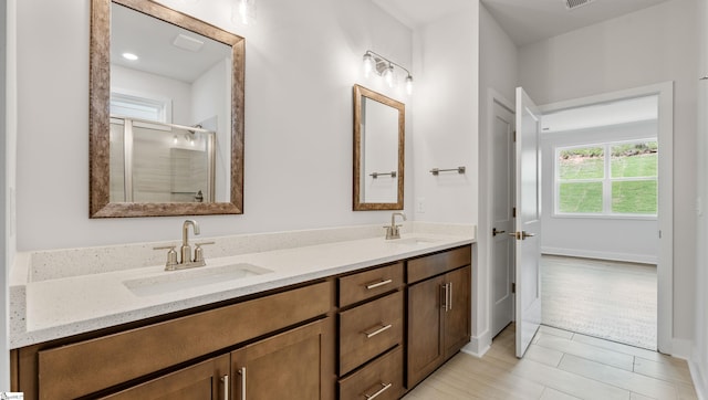 312 Fiery Rd Lot 0170, Mauldin, SC 29607 - full bathroom with double vanity, a shower stall, baseboards, and tile patterned flooring