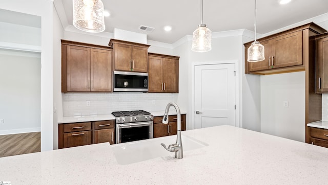 312 Fiery Rd Lot 0170, Mauldin, SC 29607 - kitchen with appliances with stainless steel finishes, decorative backsplash, pendant lighting, a sink, and recessed lighting