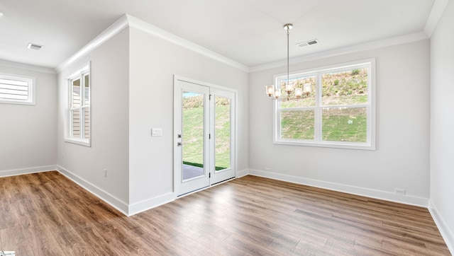 312 Fiery Rd Lot 0170, Mauldin, SC 29607 - unfurnished dining area featuring ornamental molding, a chandelier, wood finished floors, and baseboards