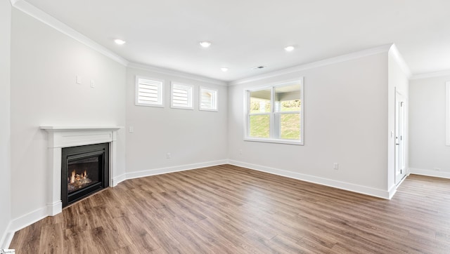 312 Fiery Rd Lot 0170, Mauldin, SC 29607 - unfurnished living room with ornamental molding, wood finished floors, a glass covered fireplace, baseboards, and recessed lighting