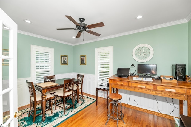 dining room with ceiling fan, ornamental molding, and hardwood / wood-style floors