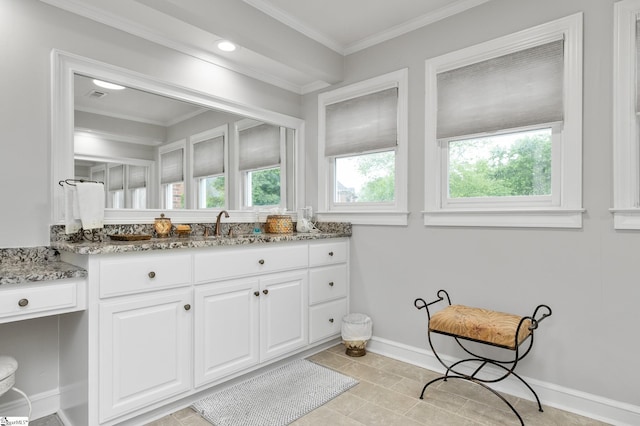 bathroom with vanity, tile patterned flooring, ornamental molding, and a healthy amount of sunlight