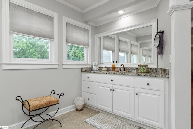 bathroom with vanity and ornamental molding