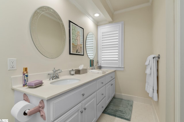 bathroom featuring vanity, crown molding, and tile patterned floors