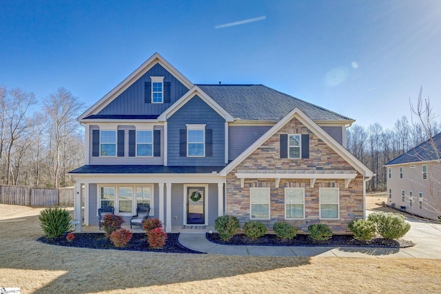 craftsman-style house featuring a front lawn and a porch