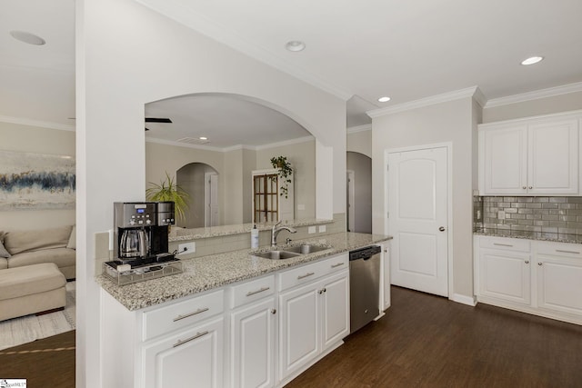 kitchen with white cabinetry, sink, stainless steel dishwasher, and light stone counters