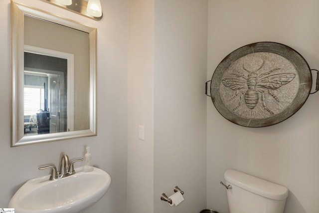 bathroom with sink and toilet