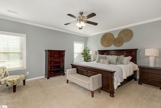 bedroom with light carpet, ornamental molding, and ceiling fan