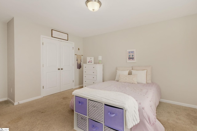 carpeted bedroom with a closet