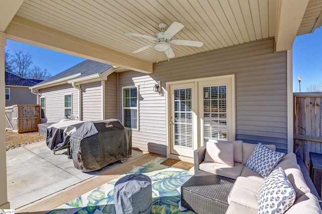 view of patio / terrace with ceiling fan, grilling area, and an outdoor living space