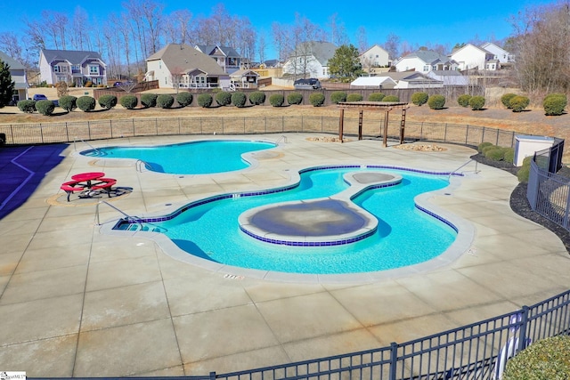 view of swimming pool featuring a patio area