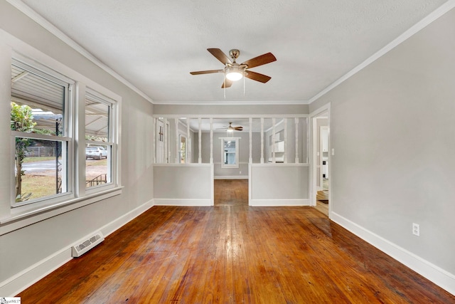 unfurnished room featuring crown molding, hardwood / wood-style flooring, and ceiling fan