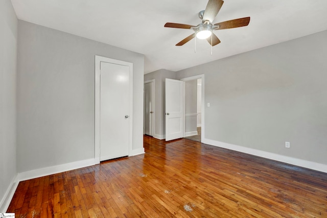 unfurnished room featuring ceiling fan and wood-type flooring