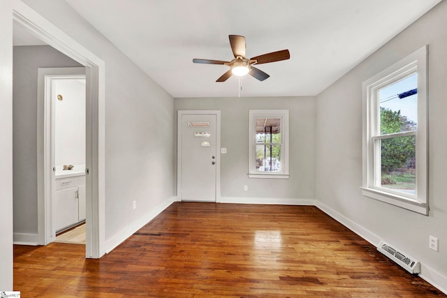 unfurnished room featuring hardwood / wood-style floors and ceiling fan