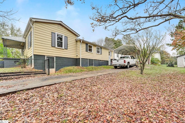 view of home's exterior featuring a carport