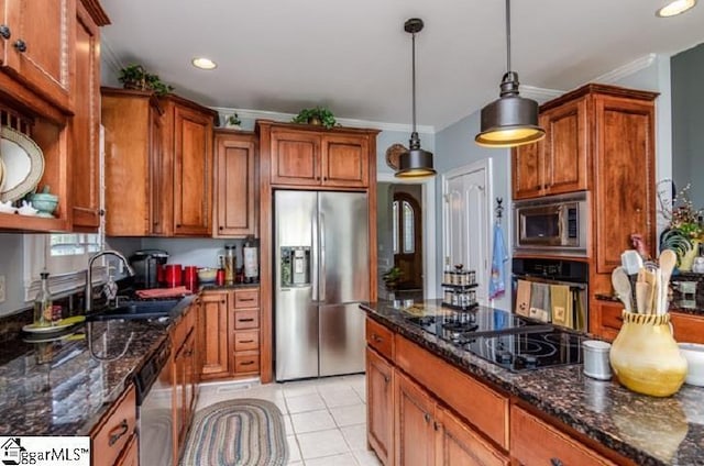 kitchen featuring light tile patterned flooring, sink, pendant lighting, dark stone counters, and black appliances