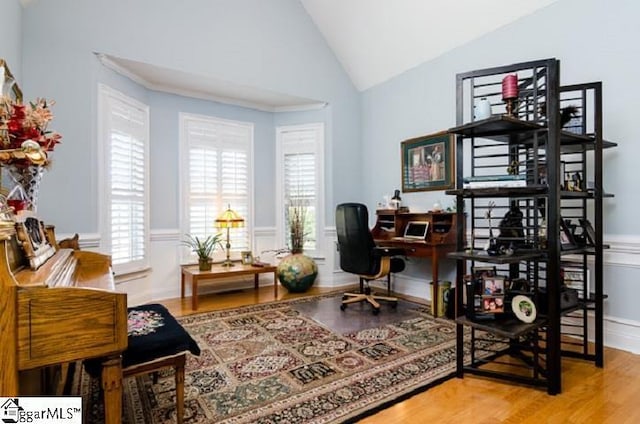 office area featuring hardwood / wood-style flooring and vaulted ceiling