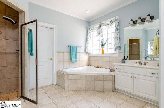 bathroom with tile patterned flooring, ornamental molding, vanity, and plus walk in shower