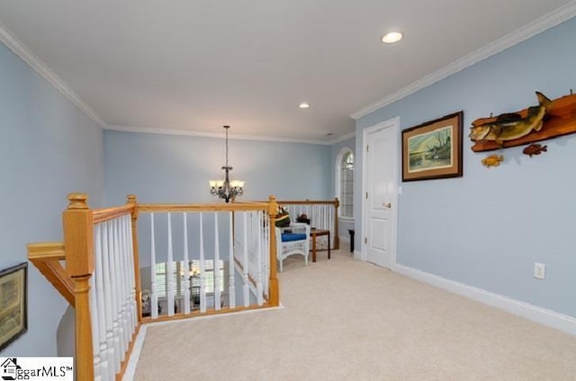 hall with crown molding, light colored carpet, and a chandelier