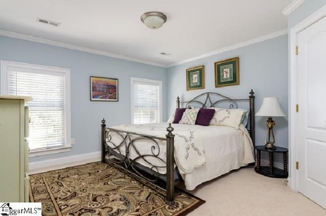 carpeted bedroom with ornamental molding