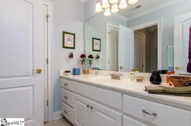 bathroom with vanity, crown molding, and a chandelier