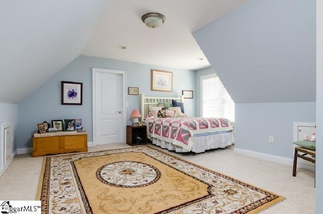 bedroom with lofted ceiling and carpet flooring