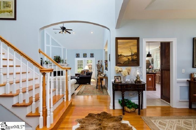 foyer with ceiling fan and light hardwood / wood-style floors