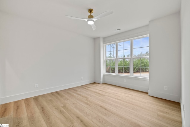 spare room with ceiling fan and light hardwood / wood-style floors