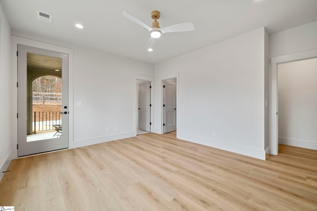 unfurnished bedroom featuring ceiling fan, access to exterior, and light hardwood / wood-style flooring