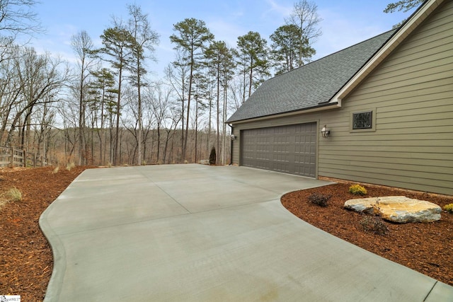 view of side of property with a garage