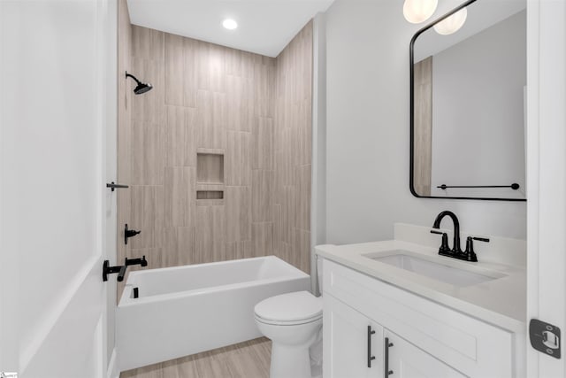 full bathroom with vanity, shower / bathing tub combination, hardwood / wood-style floors, and toilet