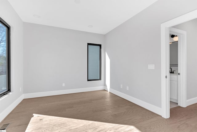 unfurnished room featuring light wood-type flooring