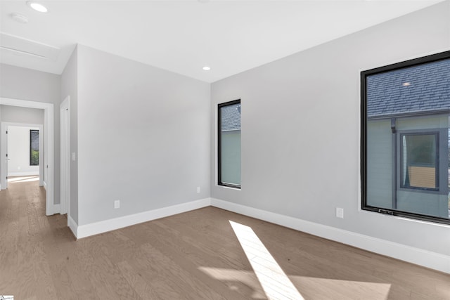 spare room with light hardwood / wood-style flooring