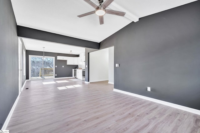 unfurnished living room with ceiling fan with notable chandelier, lofted ceiling with beams, and light wood-type flooring