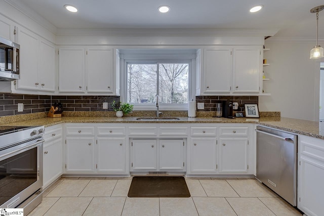 kitchen featuring stainless steel appliances, sink, and white cabinets