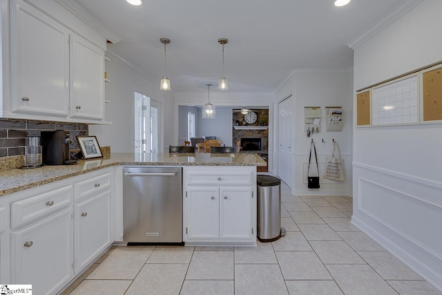 kitchen with dishwasher, white cabinetry, ornamental molding, decorative light fixtures, and kitchen peninsula