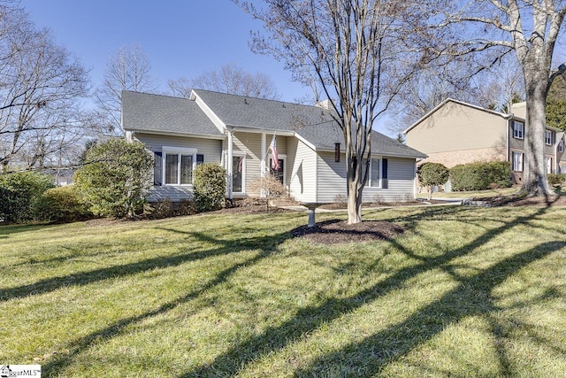 ranch-style house with a front lawn