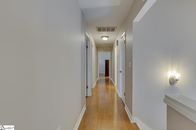 corridor featuring light hardwood / wood-style floors