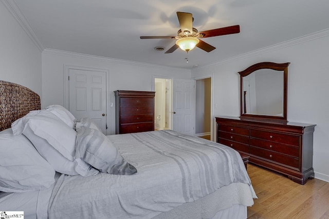 bedroom with crown molding, ceiling fan, and light wood-type flooring