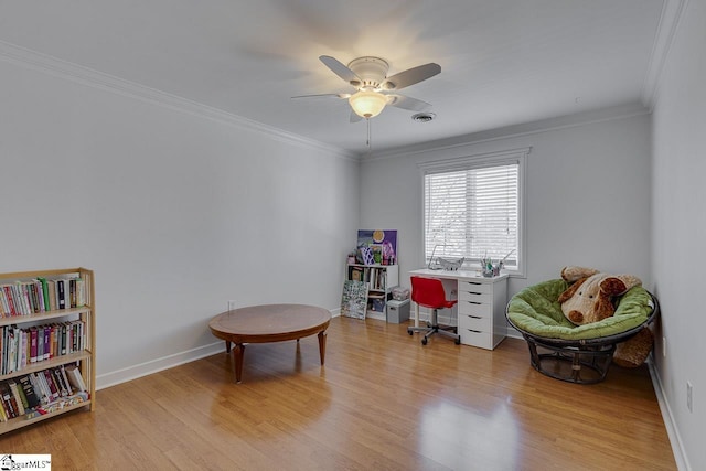 sitting room with ornamental molding, light hardwood / wood-style floors, and ceiling fan