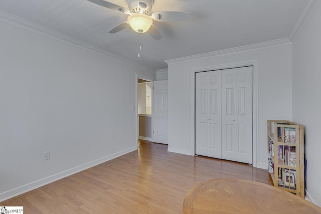 unfurnished bedroom with crown molding, light hardwood / wood-style floors, ceiling fan, and a closet