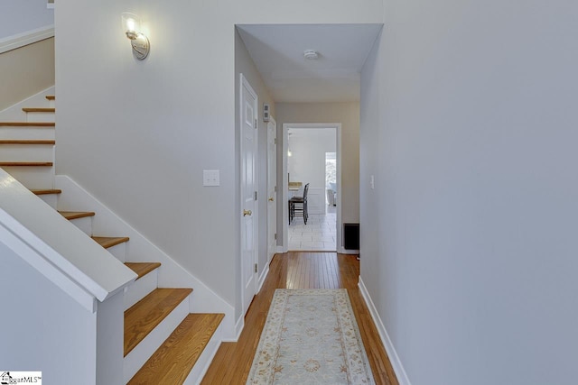 hallway featuring wood-type flooring