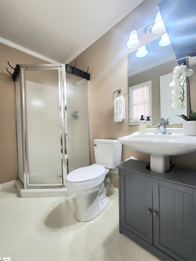 bathroom with crown molding, vanity, toilet, and an enclosed shower